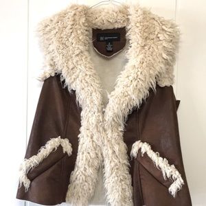 Women faux fur vest size medium , good condition .